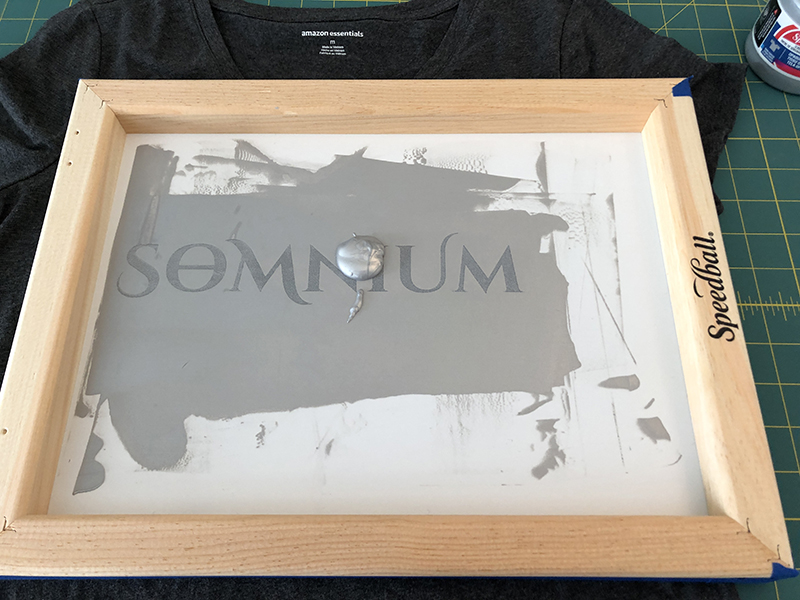 Add ink to the screen printing frame